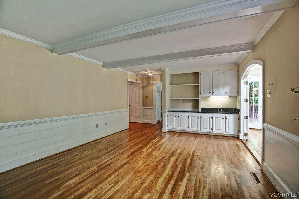 14163 Grangewood Road Midlothian, VA 23113 - Photo 10 of 24 a large space with wooden floor and a kitchen
