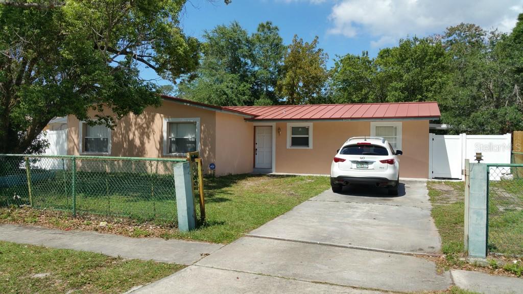 6438 Sawyer Road Tampa, FL 33634 - Photo 1 of 1 a front view of a house with garden