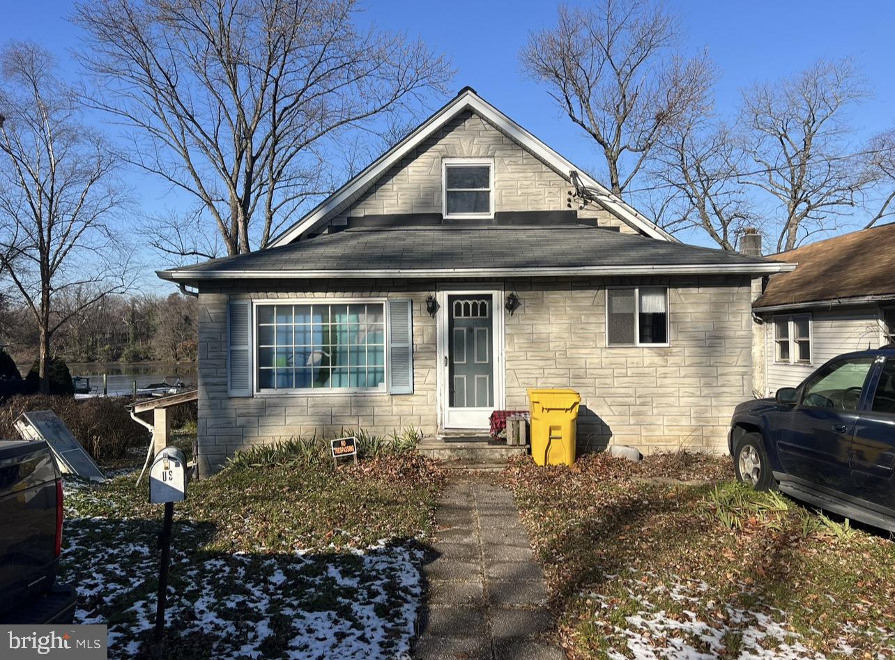 13 Beach Road Glen Burnie, MD 21060 - Photo 1 of 20 a front view of a house with garden