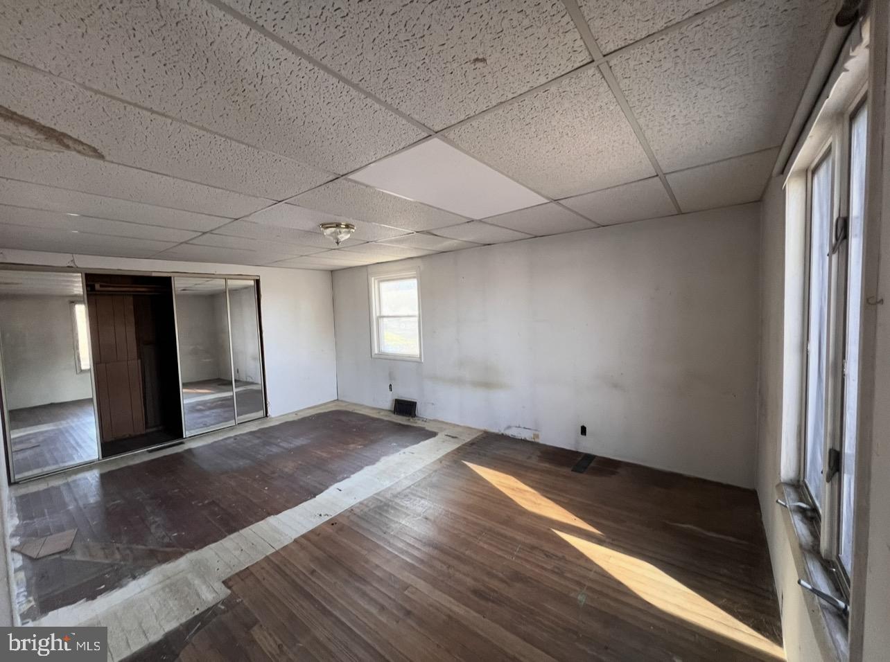 13 Beach Road Glen Burnie, MD 21060 - Photo 14 of 20 a view of empty room with wooden floor and fan