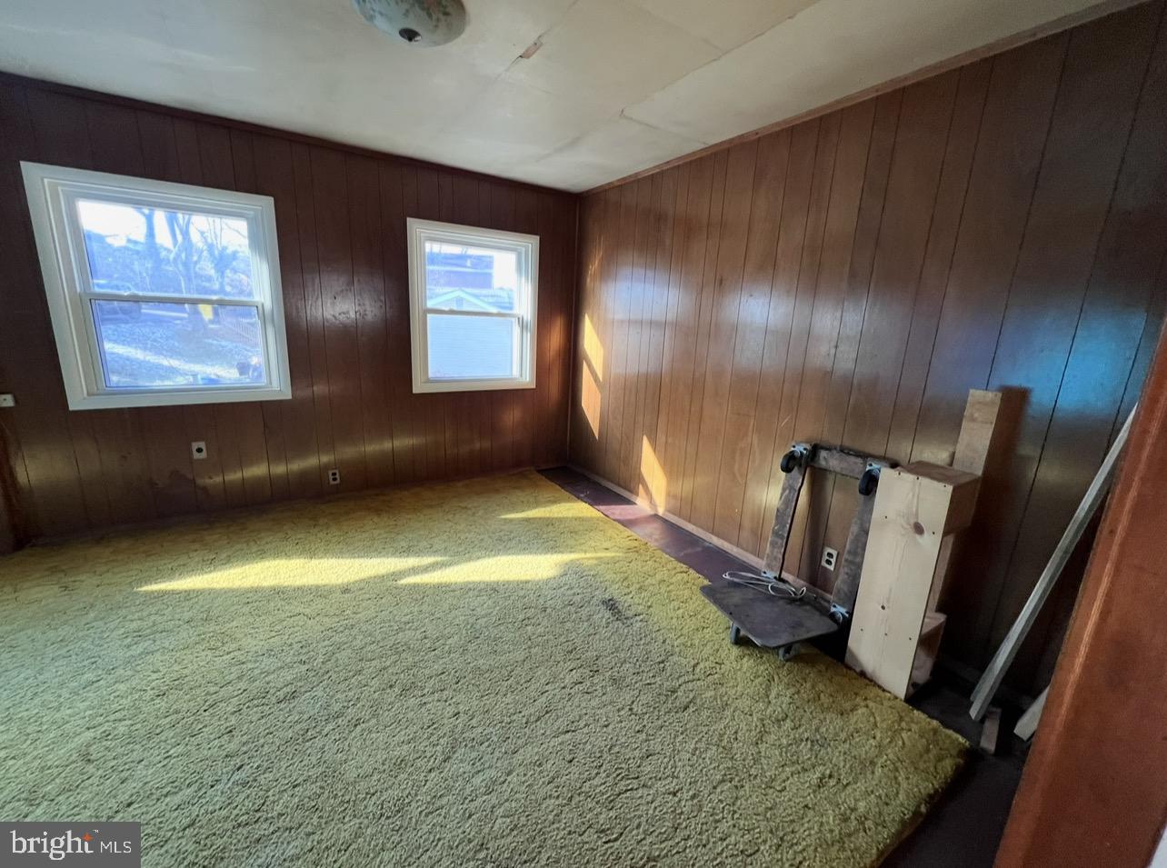 13 Beach Road Glen Burnie, MD 21060 - Photo 8 of 20 a view of an empty room with a fireplace and a window