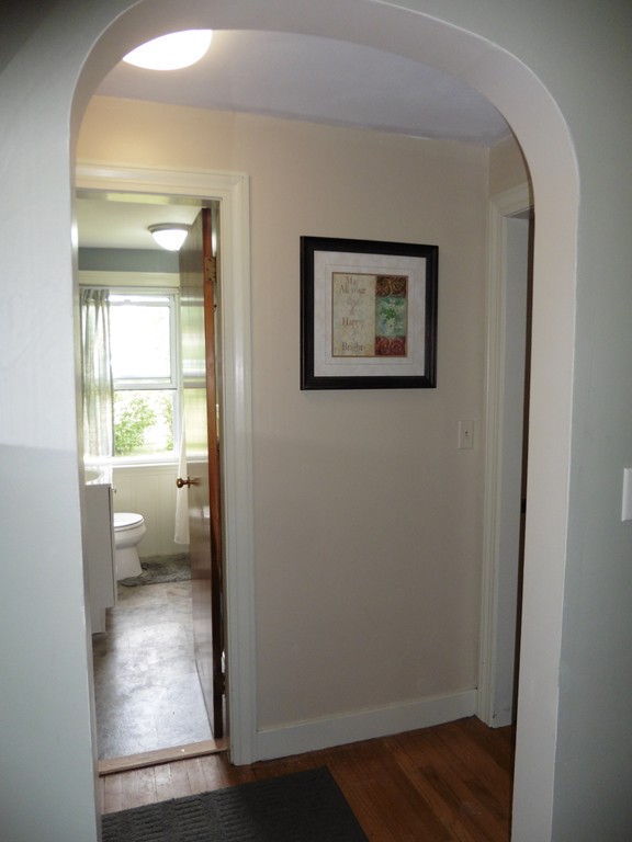 2020 Pine Street Three Rivers, MA 01080 - Photo 17 of 24 a view of a hallway with wooden floor and a bathroom