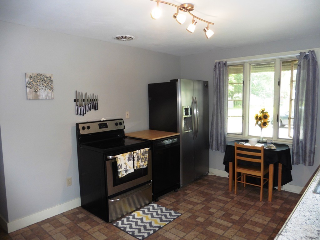 2020 Pine Street Three Rivers, MA 01080 - Photo 8 of 24 a kitchen with a stove and a refrigerator