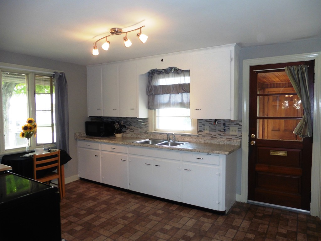 2020 Pine Street Three Rivers, MA 01080 - Photo 10 of 24 a kitchen with a sink stove and cabinets
