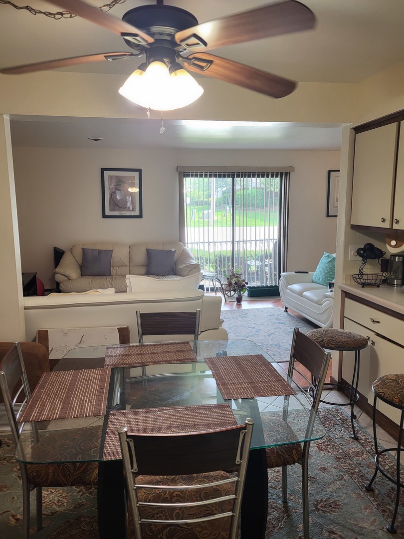6345 Birmingham Street, Unit 1C Chicago Ridge, IL 60415 - Photo 8 of 24 a living room with furniture and a large window