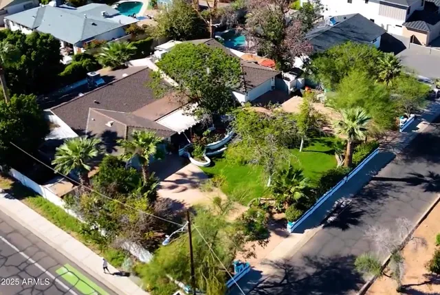 an aerial view of house with yard
