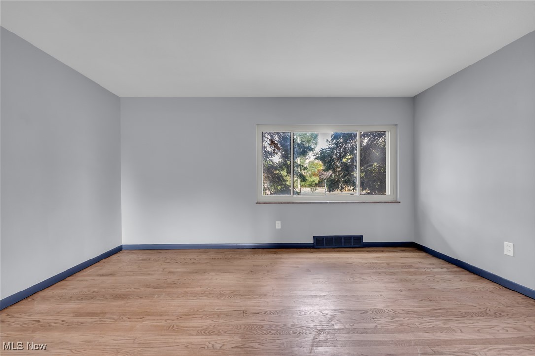 5235 State Road, Unit 3 Cleveland, OH 44134 - Photo 7 of 21 Empty room with light wood-type flooring