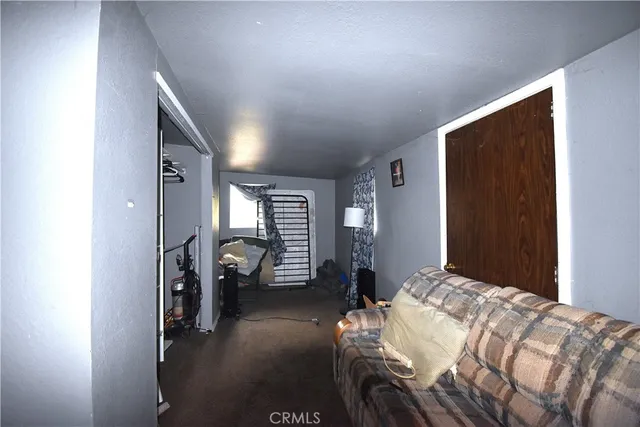 a bedroom with a bed and a walk in closet