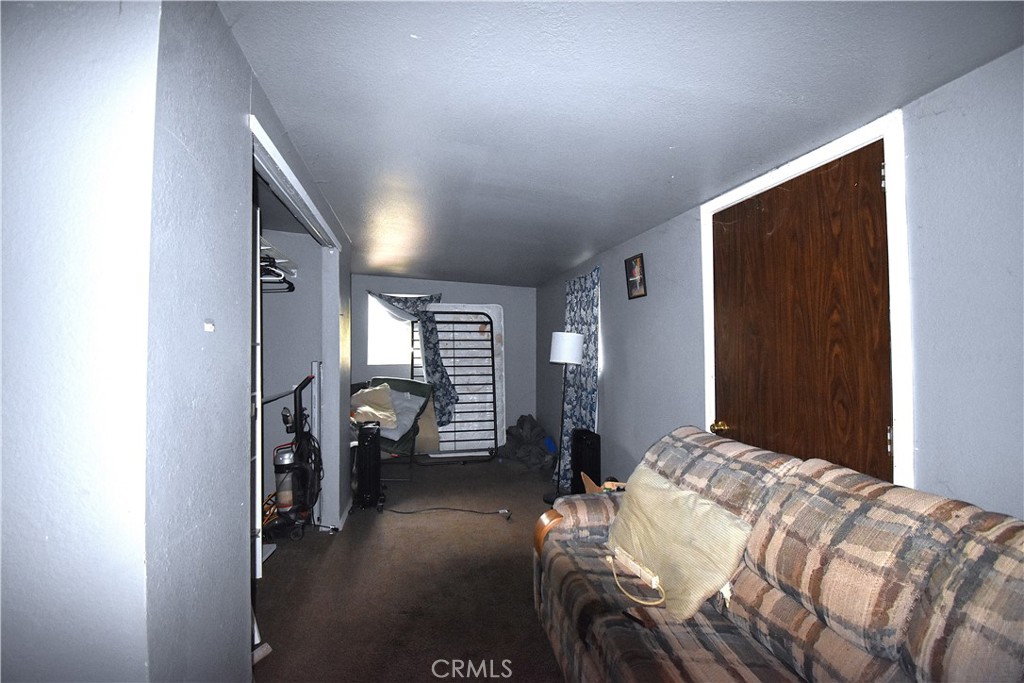 233 Renegade Road Oroville, CA 95966 - Photo 12 of 44 a bedroom with a bed and a walk in closet