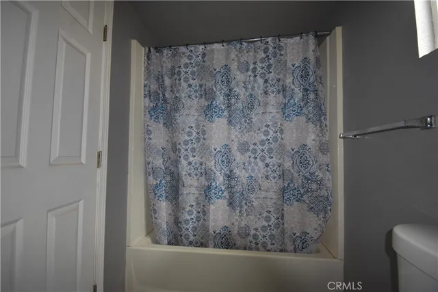 a bathroom with a shower curtain