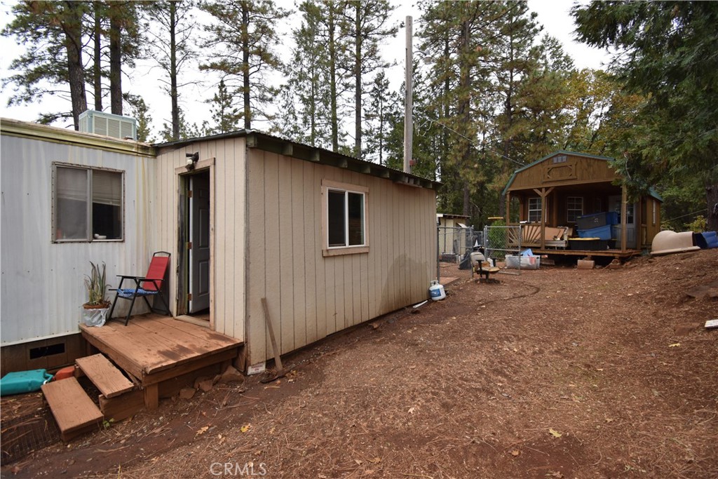 233 Renegade Road Oroville, CA 95966 - Photo 22 of 44 a backyard of a house with outdoor seating