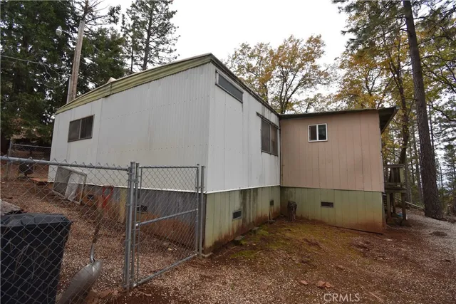 a house with trees in the background