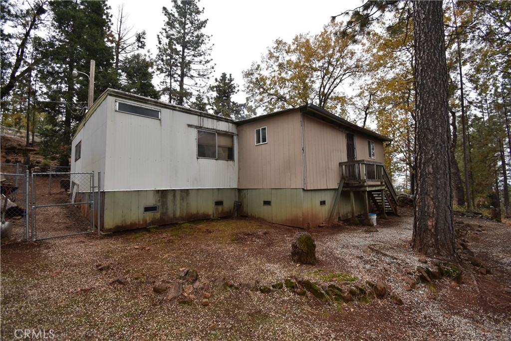 233 Renegade Road Oroville, CA 95966 - Photo 29 of 44 a house with trees in the background