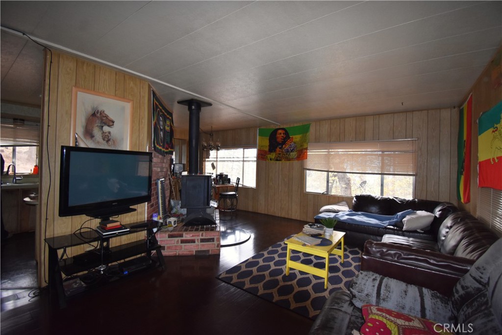 233 Renegade Road Oroville, CA 95966 - Photo 7 of 44 a living room with furniture and a flat screen tv