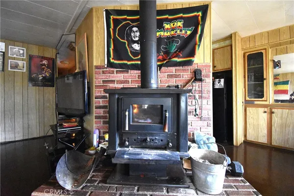 a living room with fireplace furniture and a fireplace
