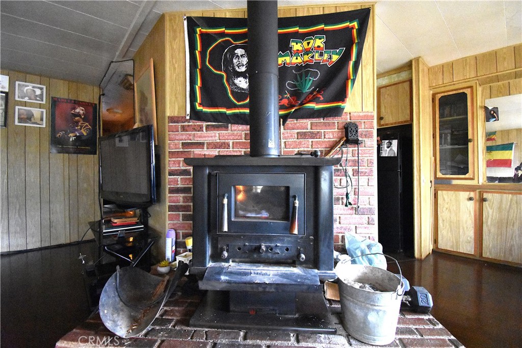 233 Renegade Road Oroville, CA 95966 - Photo 8 of 44 a living room with fireplace furniture and a fireplace