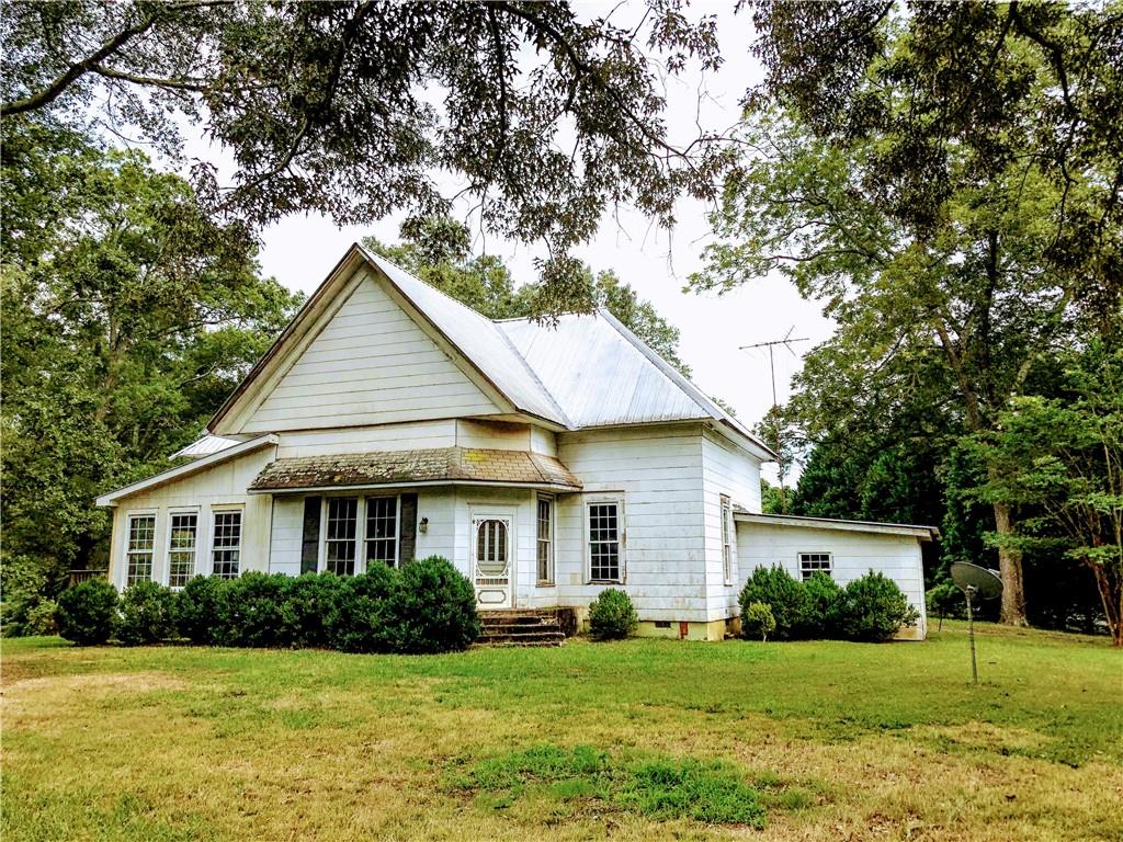 512 Elder Road Southeast Winder, GA 30680 - Photo 1 of 1 a front view of a house with a yard