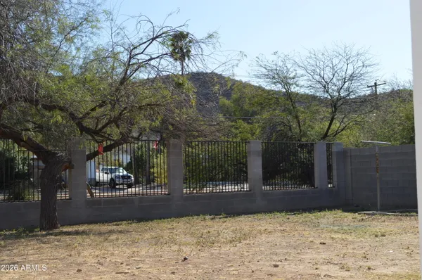 a view of a house with a yard covered in snow