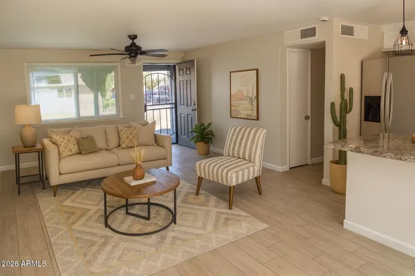 a living room with furniture and a large window