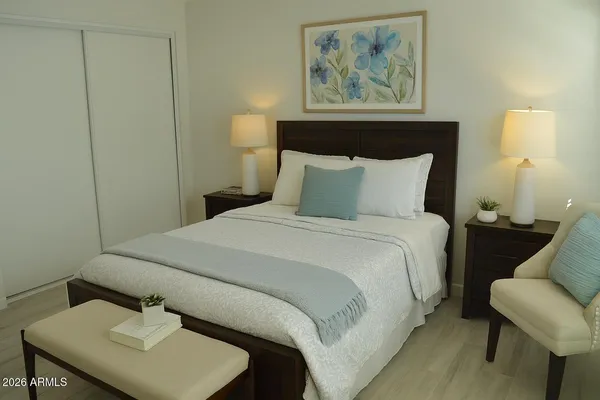 a bedroom with a bed and bathroom