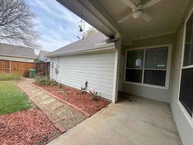 a view of backyard with large windows