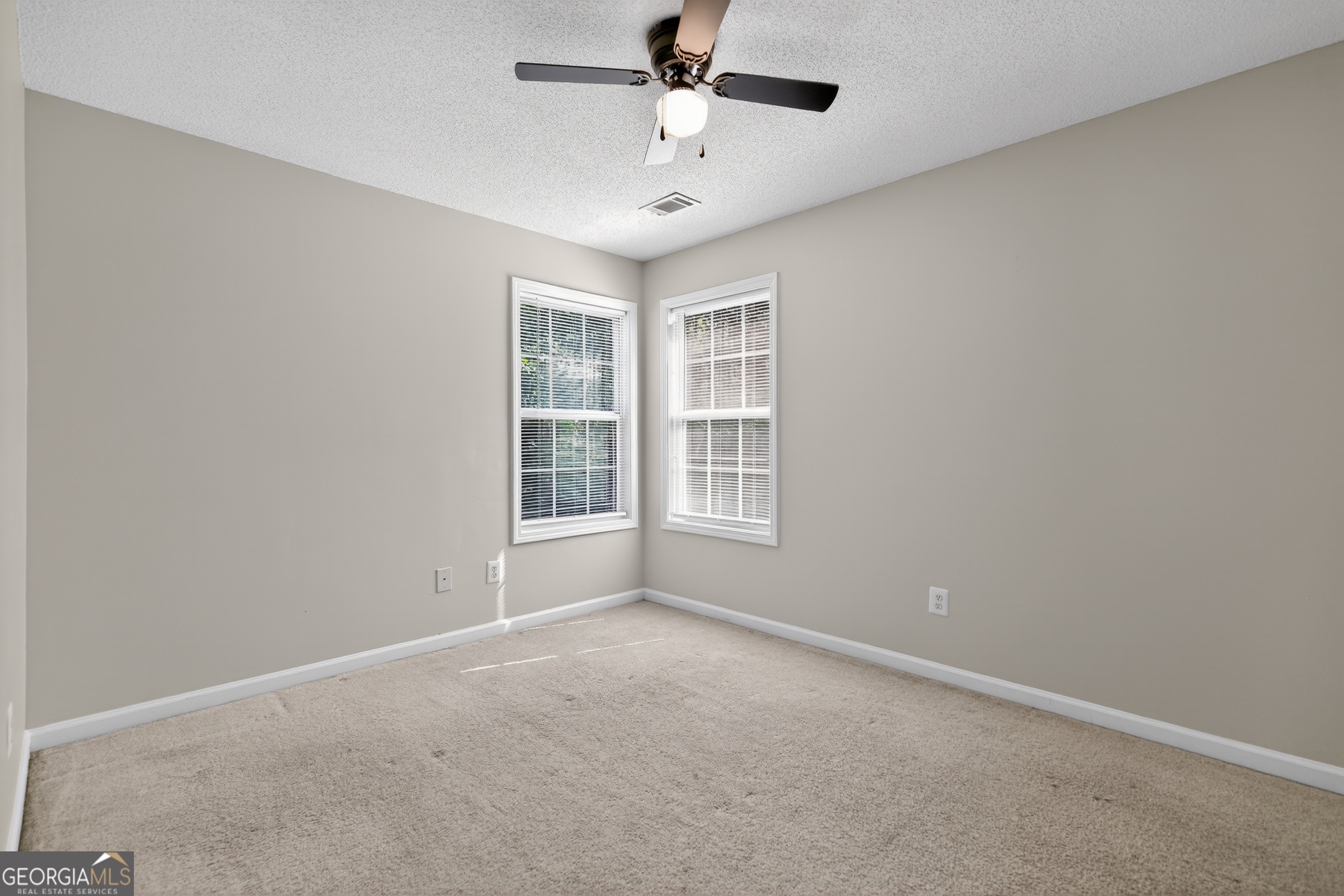 178 Rachel Boulevard Temple, GA 30179 - Photo 14 of 30 an empty room with windows and fan