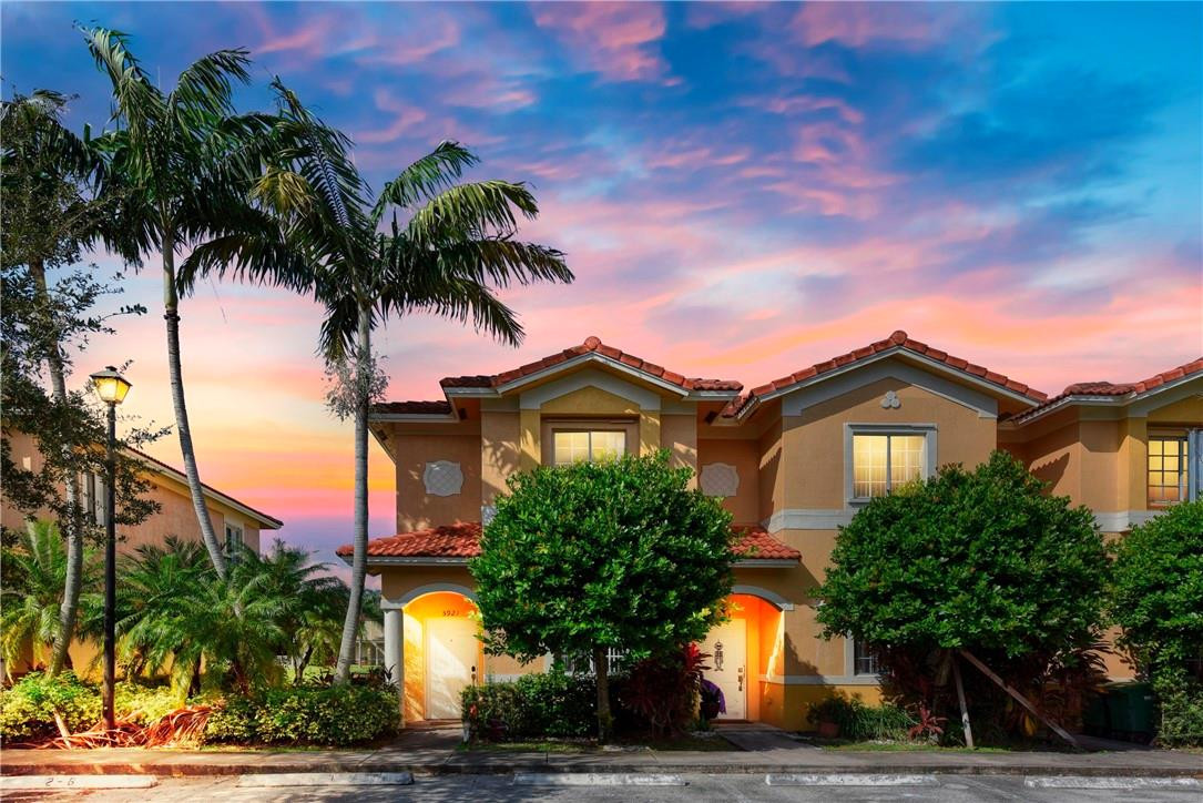 5921 Riverside Avenue Tamarac, FL 33321 - Photo 1 of 22 a front view of a house with a yard