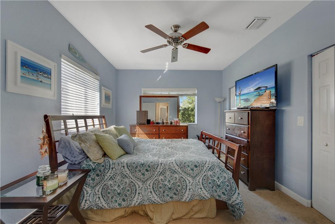5921 Riverside Avenue Tamarac, FL 33321 - Photo 22 of 22 a bedroom with a bed a window and dresser