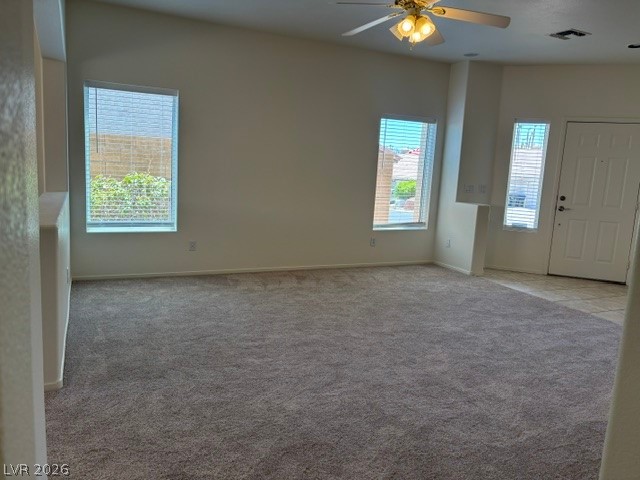 2866 Shimmering Bay Street Laughlin, NV 89029 - Photo 7 of 32 A spacious living room features high ceilings and multiple windows.