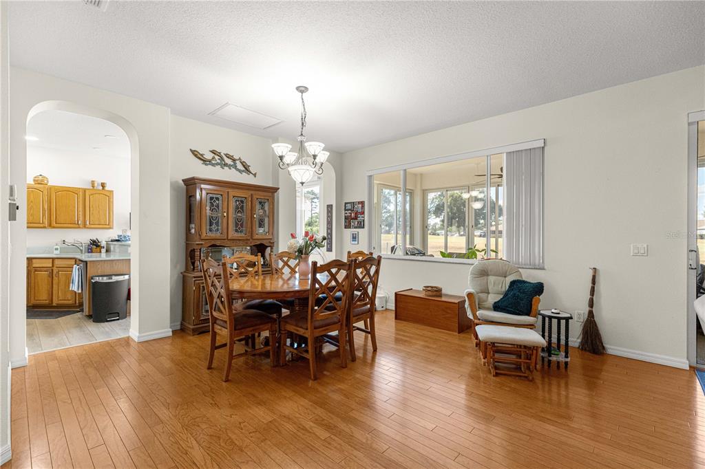 9250 Southwest 96th Court Road Ocala, FL 34481 - Photo 11 of 46 a living room with furniture and a chandelier