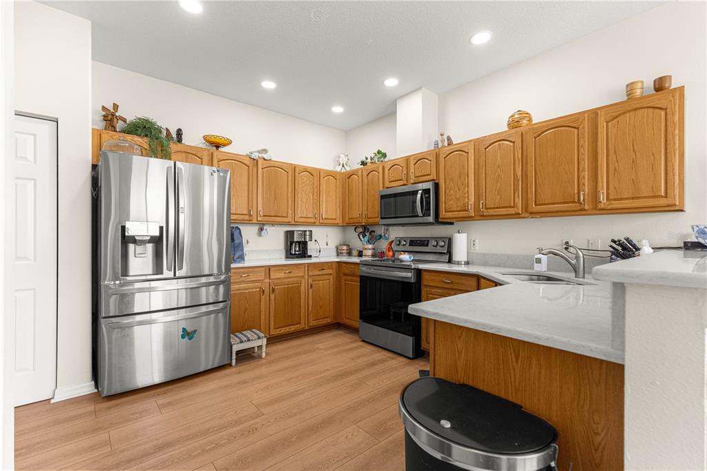 9250 Southwest 96th Court Road Ocala, FL 34481 - Photo 13 of 46 a kitchen with stainless steel appliances granite countertop a refrigerator sink and microwave