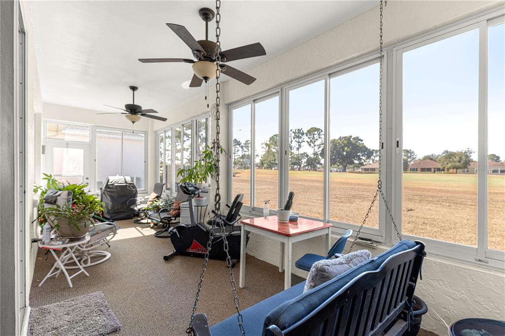 9250 Southwest 96th Court Road Ocala, FL 34481 - Photo 18 of 46 a living room with furniture and floor to ceiling windows