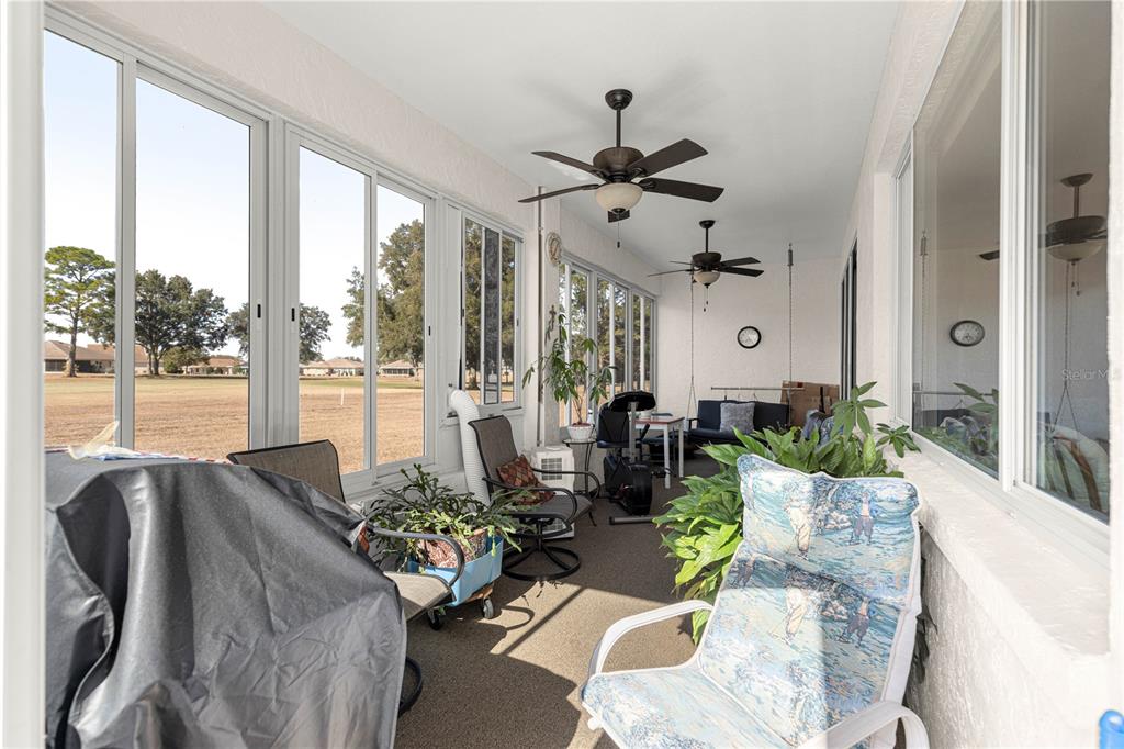 9250 Southwest 96th Court Road Ocala, FL 34481 - Photo 19 of 46 a living room with furniture and a large window