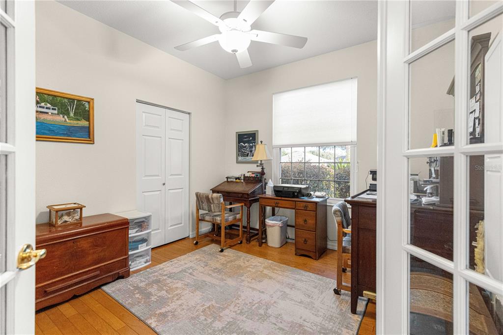 9250 Southwest 96th Court Road Ocala, FL 34481 - Photo 20 of 46 a view of a workspace with furniture and a window