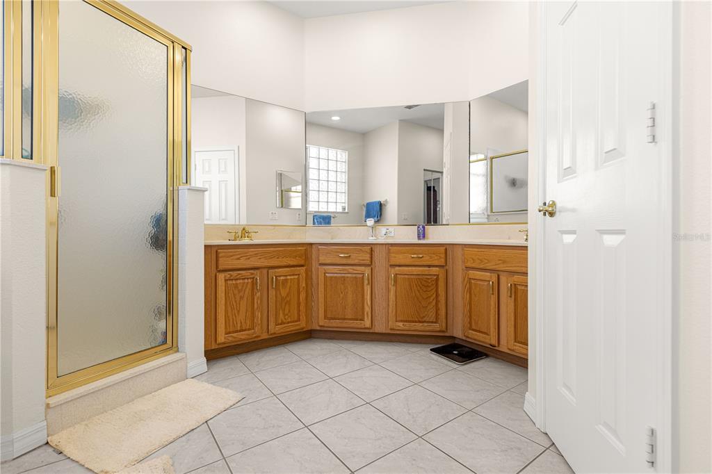 9250 Southwest 96th Court Road Ocala, FL 34481 - Photo 26 of 46 a kitchen with a sink a stove cabinets and a window