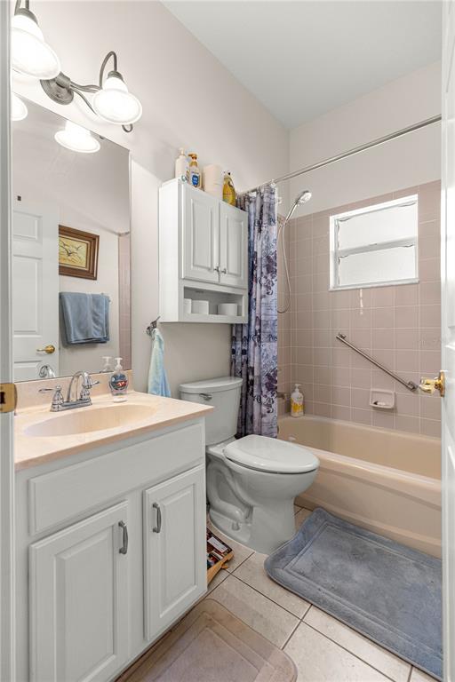 9250 Southwest 96th Court Road Ocala, FL 34481 - Photo 32 of 46 a bathroom with a sink a toilet and shower