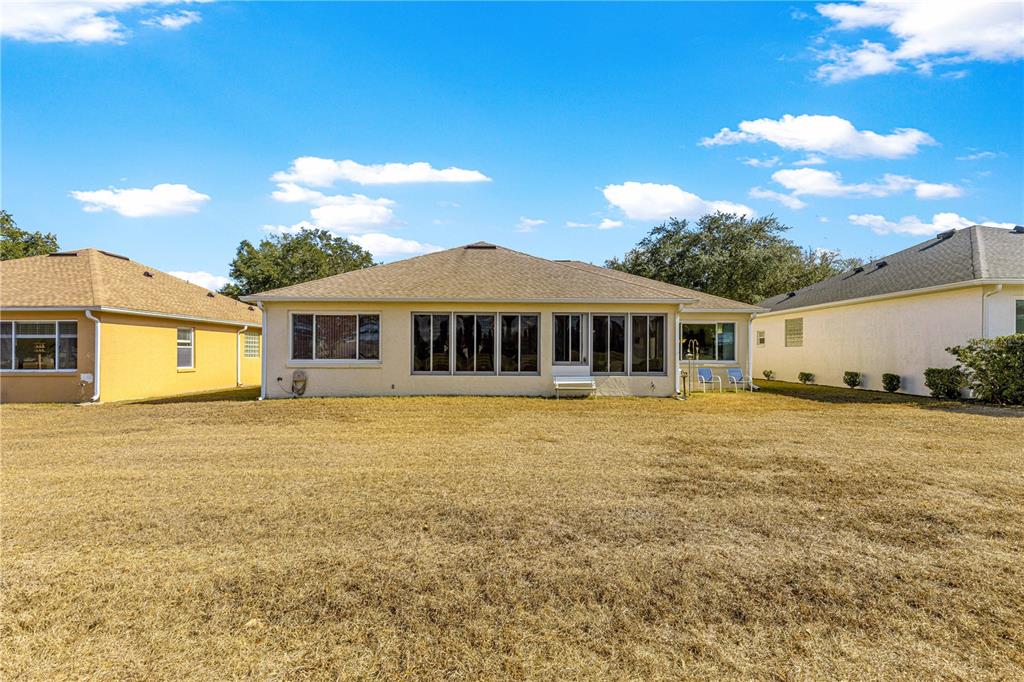 9250 Southwest 96th Court Road Ocala, FL 34481 - Photo 37 of 46 a house view with a garden space