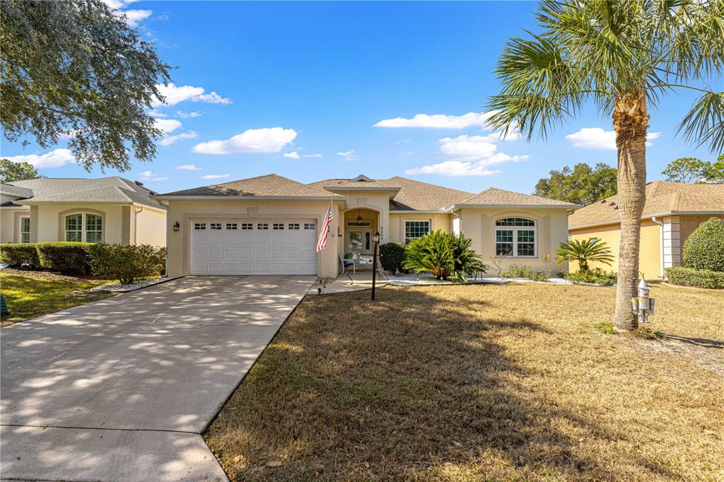 9250 Southwest 96th Court Road Ocala, FL 34481 - Photo 43 of 46 a view of a house with a yard and palm trees