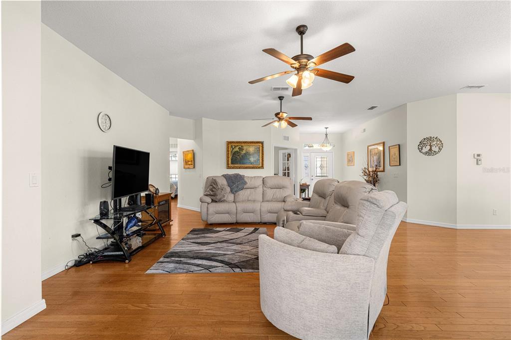 9250 Southwest 96th Court Road Ocala, FL 34481 - Photo 5 of 46 a living room with furniture and a flat screen tv