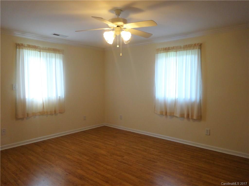 2250 Goodnight Road Salisbury, NC 28147 - Photo 14 of 21 a view of an empty room with wooden floor and a window