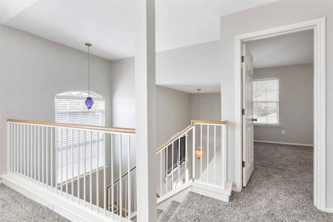 9405 Billingham Trail Austin, TX 78717 - Photo 21 of 40 a view of a hallway with windows