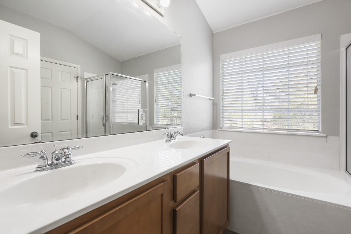 9405 Billingham Trail Austin, TX 78717 - Photo 25 of 40 a bathroom with a sink and a bathtub