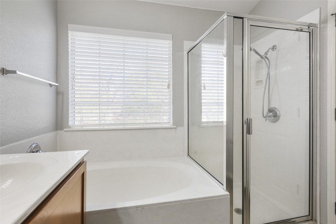 9405 Billingham Trail Austin, TX 78717 - Photo 3 of 40 a bathroom with a bathtub and a shower