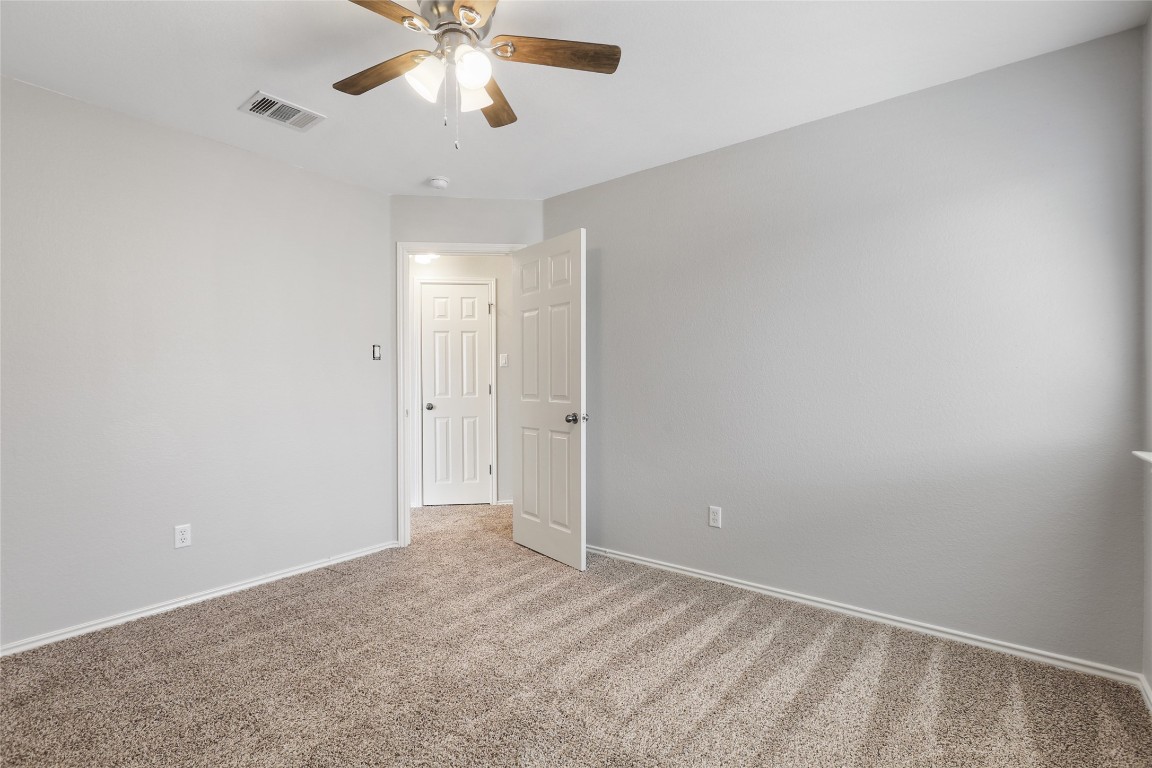 9405 Billingham Trail Austin, TX 78717 - Photo 32 of 40 a view of an empty room and chandelier fan