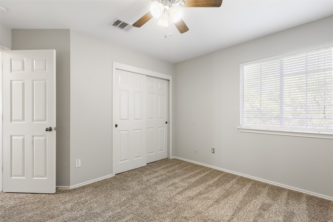 9405 Billingham Trail Austin, TX 78717 - Photo 34 of 40 a view of a livingroom with a ceiling fan and window