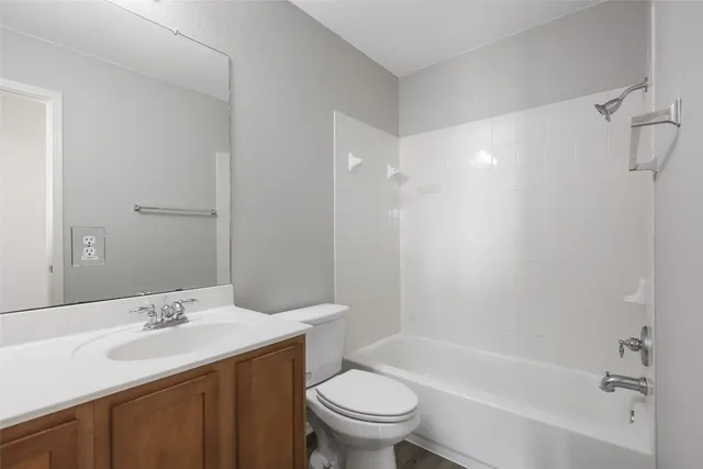 a bathroom with a sink a toilet and a bathtub