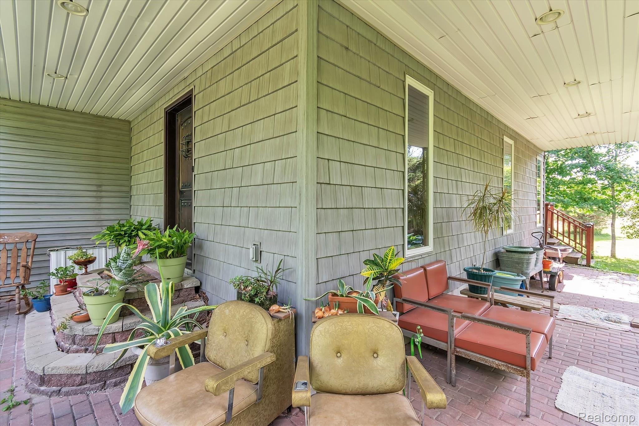 11174 Sharp Road Linden, MI 48451 - Photo 49 of 54 49 11174 Sharp - side patio with overhang.jpg