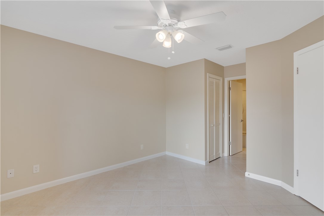 9632 Riverside Drive, Unit 2 Sebastian, FL 32958 - Photo 15 of 29 an empty room with a ceiling fan and a window
