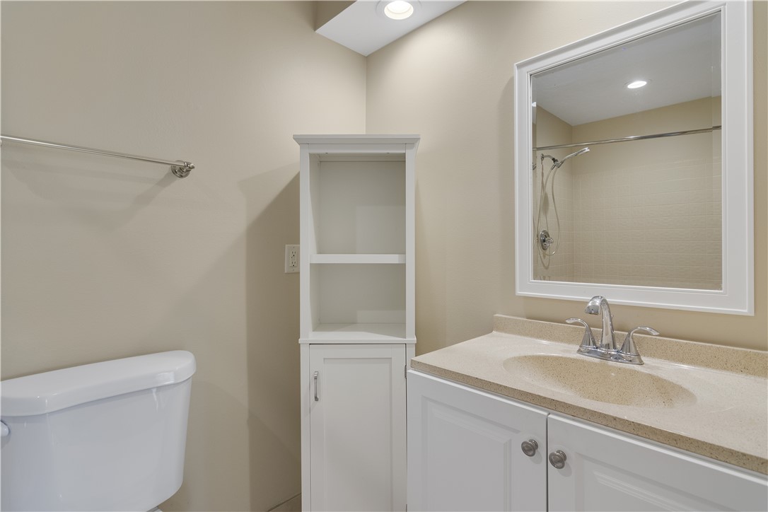 9632 Riverside Drive, Unit 2 Sebastian, FL 32958 - Photo 17 of 29 a bathroom with a sink toilet and vanity