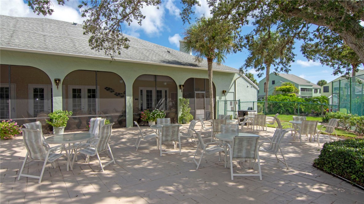 9632 Riverside Drive, Unit 2 Sebastian, FL 32958 - Photo 23 of 29 a front view of a house with outdoor seating